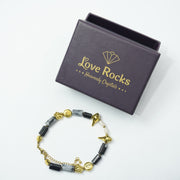 Snowflake Obsidian Bracelet: Conch and Lotus Charms